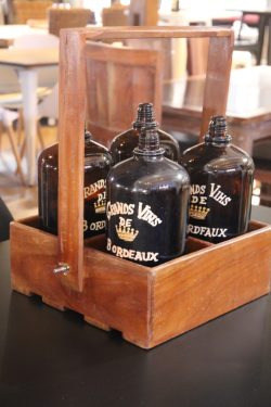 Wooden tray with 4 glass bottles