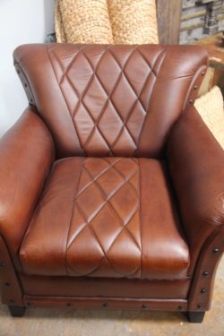 Studded leather armchair
