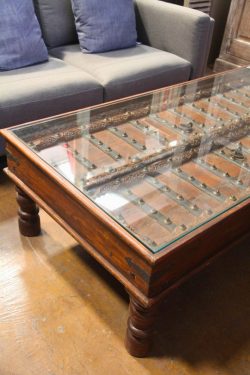 Wooden coffee table with glass top